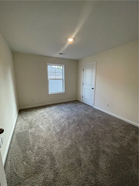 Spacious, unfurnished interior of a new home in Springwood Grove, Central (Image 30).