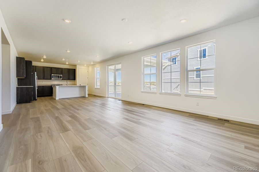 Furnished interior in a model home at Newlin Crossing: The Monarch Collection in Parker (Image 7).