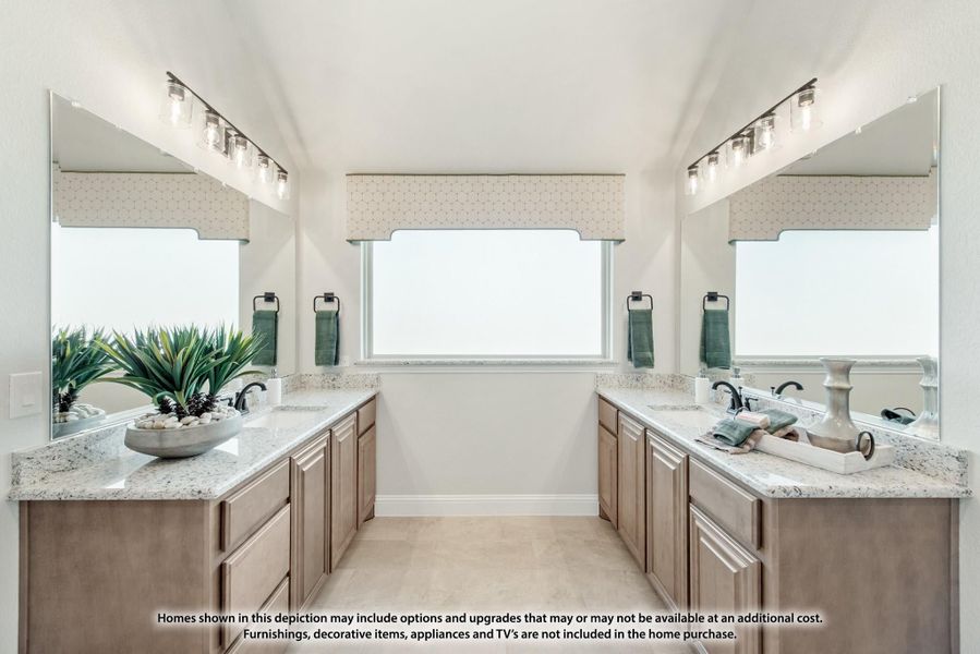 Bathroom with dual vanities, granite countertops, wood cabinets, and large mirrors with vanity lighting Bathroom with dual vanities, granite countertops, wood cabinets, and large mirrors with vanity lighting