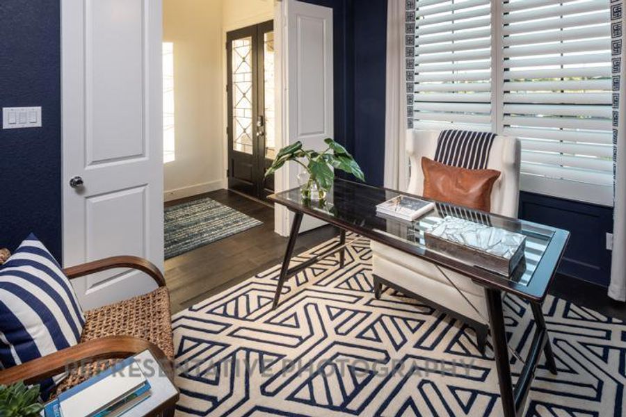 Office with wood finished floors and french doors Office with wood finished floors and french doors