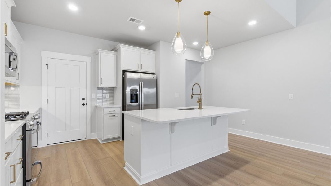 Furnished interior view inside a new home in Village at Midway, Anderson (Image 10).
