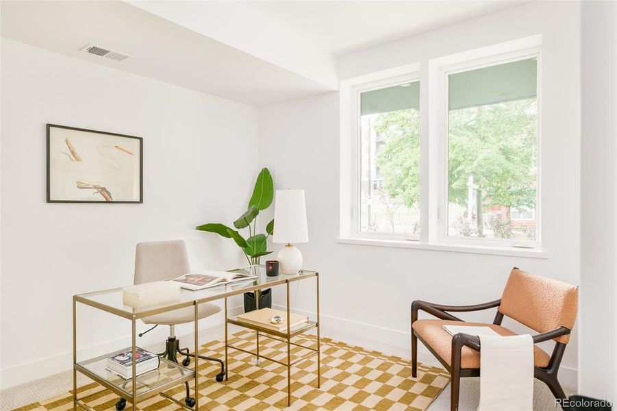 The main floor offers two bedrooms, perfect for guests or home offices