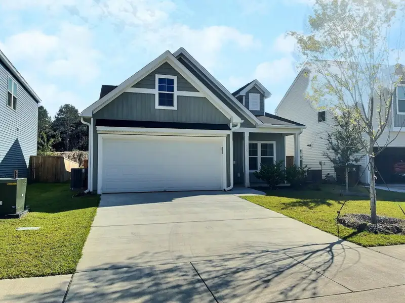 Front exterior of a new home in Six Oaks, Summerville, SC, highlighting curb appeal (Image 15).