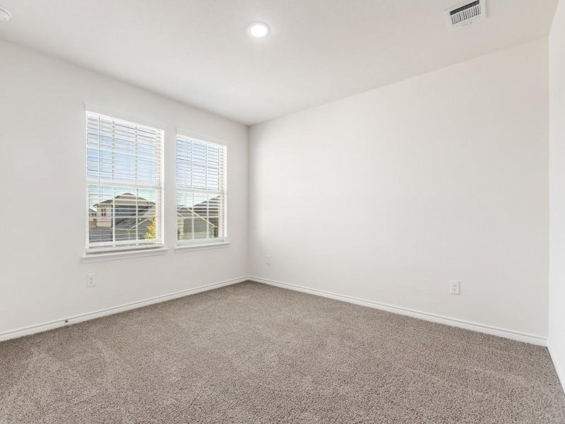 Carpeted spare room with baseboards and recessed lighting