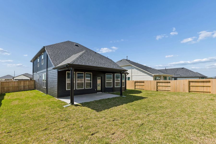 Exterior details and patio area of a home in Windcress, Cove (Image 3).