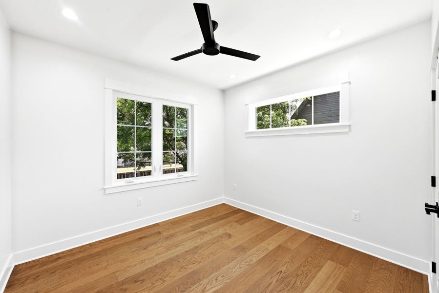 Hardwood floors and generous windows create a light and airy bedroom retreat. Hardwood floors and generous windows create a light and airy bedroom retreat.