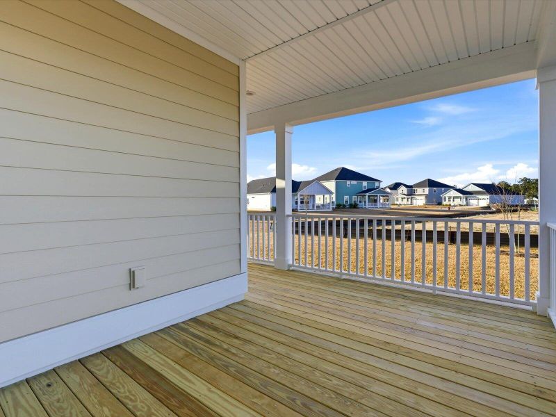 Exterior details and patio area of a home in The Coves at Lakes of Cane Bay, Summerville (Image 31). Exterior details and patio area of a home in The Coves at Lakes of Cane Bay, Summerville (Image 31).