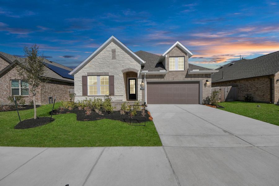 Front exterior of a new home in Bridgeland: Heritage Collection, Cypress, TX, highlighting curb appeal (Image 16). Front exterior of a new home in Bridgeland: Heritage Collection, Cypress, TX, highlighting curb appeal (Image 16).