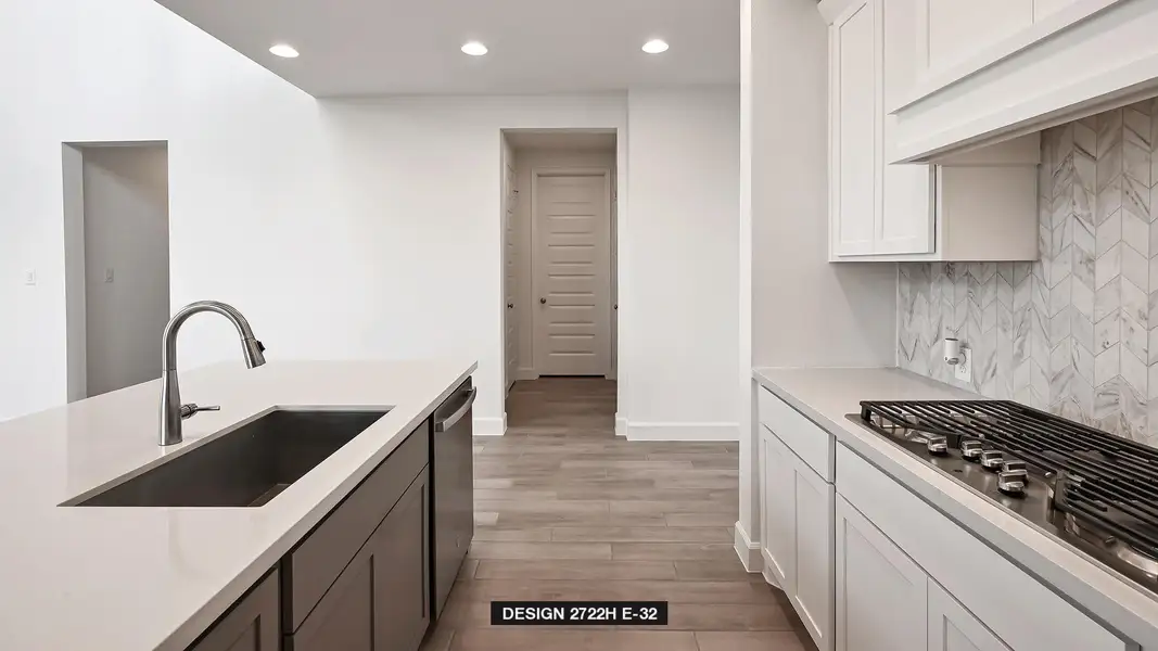 Kitchen featuring recessed lighting, light countertops, stainless steel appliances, backsplash, and light wood finished floors