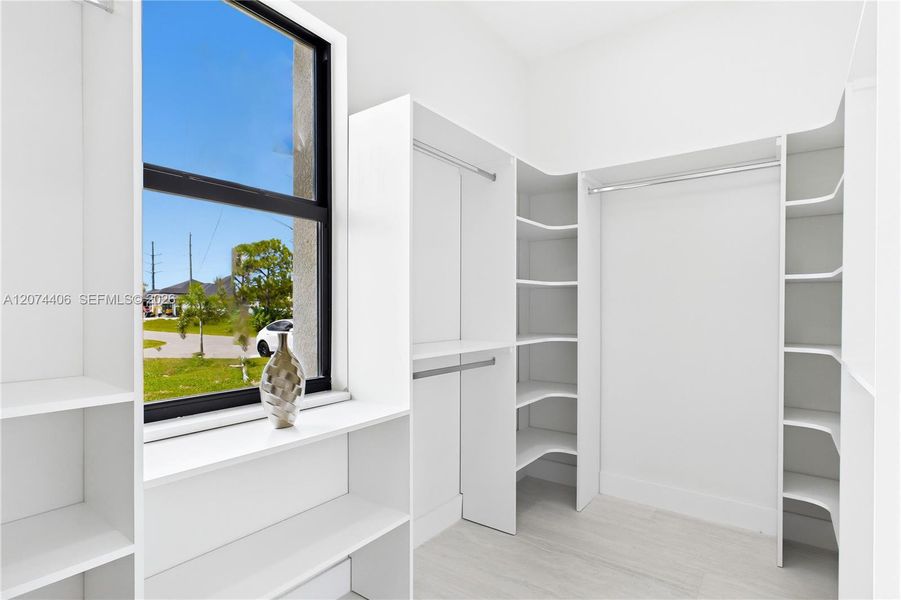 BUILT-IN CUSTOM CLOSET WHITE CABINETRY for ADDED STORAGE & CLEAN, UPSCALE LOOK. BUILT-IN CUSTOM CLOSET WHITE CABINETRY for ADDED STORAGE & CLEAN, UPSCALE LOOK.