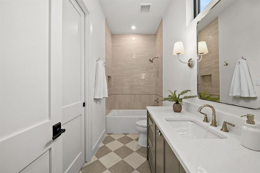 Bathroom with light flooring, vanity, tub / shower combination, and recessed lighting Bathroom with light flooring, vanity, tub / shower combination, and recessed lighting