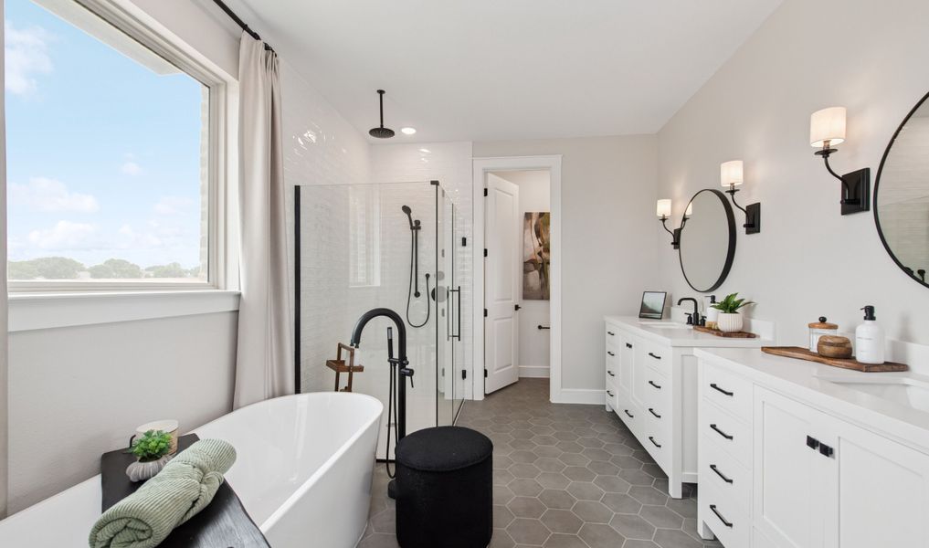 Primary bath with freestanding vanity and hexagonal tile Primary bath with freestanding vanity and hexagonal tile