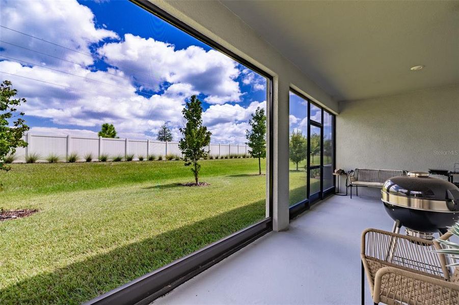 Exterior details and patio area of a home in Prosperity Lakes, Parrish (Image 33).