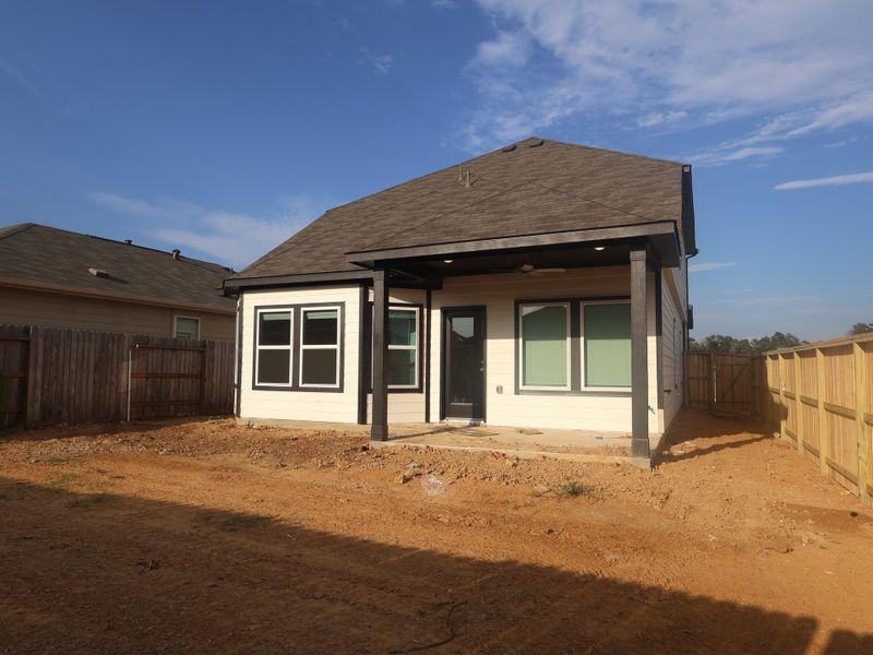 Exterior details and patio area of a home in Pinewood at Grand Texas, New Caney (Image 3). Exterior details and patio area of a home in Pinewood at Grand Texas, New Caney (Image 3).