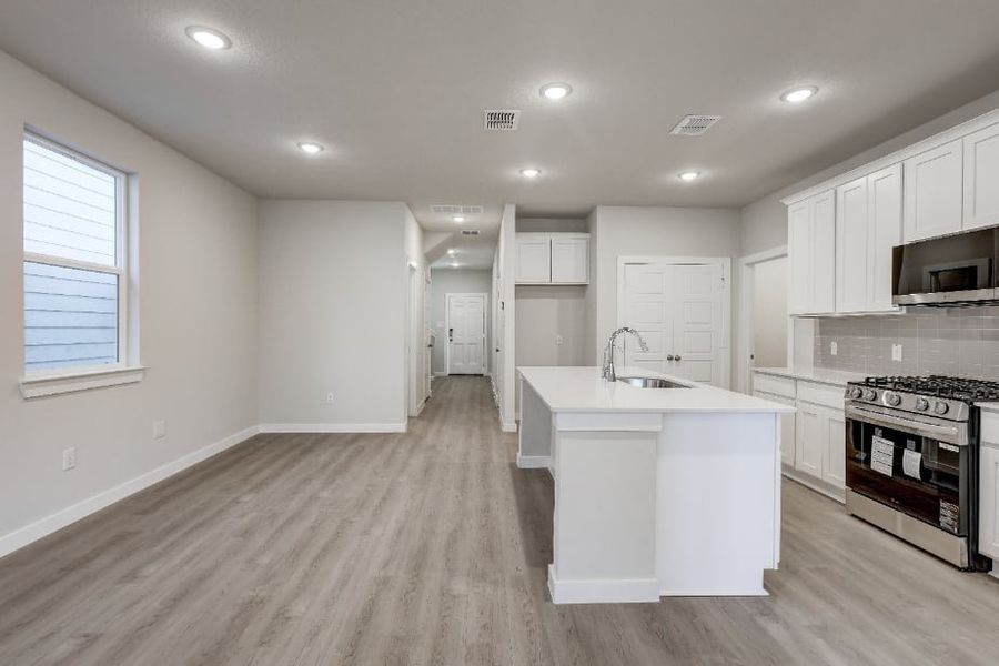 A kitchen with white cabinets. A kitchen with white cabinets.