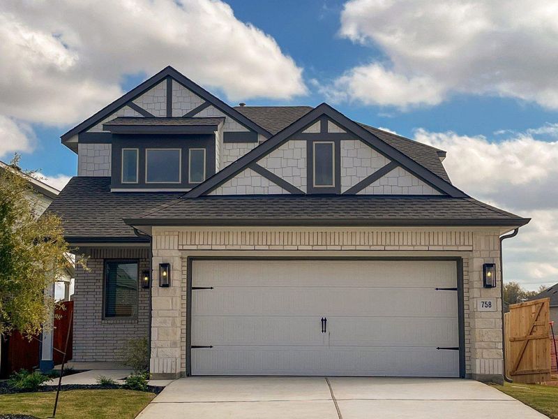 Craftsman-style house featuring a shingled roof, driveway, and stone siding Craftsman-style house featuring a shingled roof, driveway, and stone siding