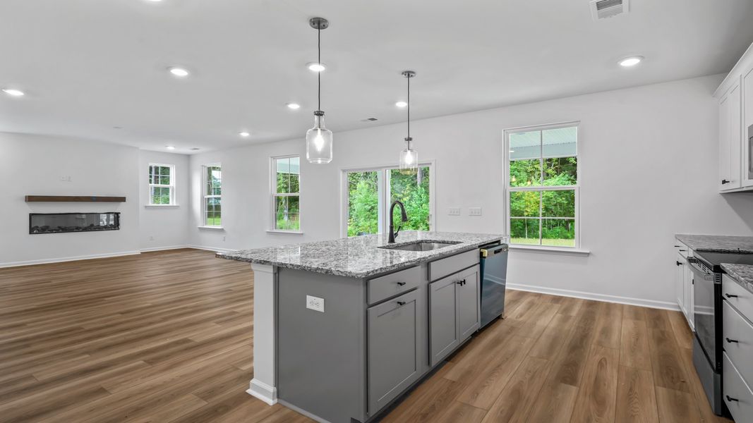 Spacious open layout connects the kitchen and living