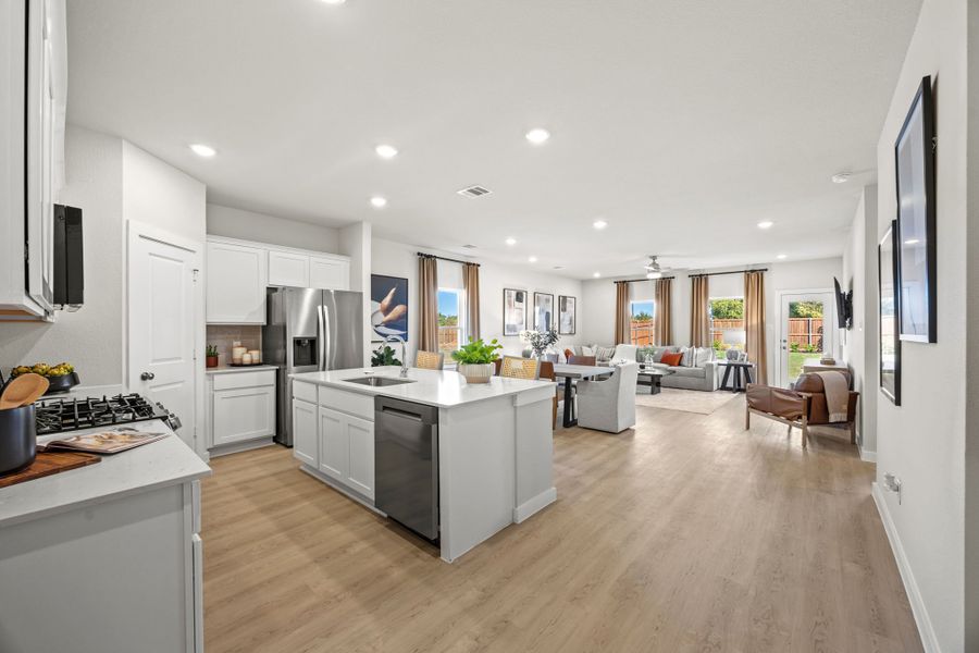 A kitchen with white cabinets. A kitchen with white cabinets.