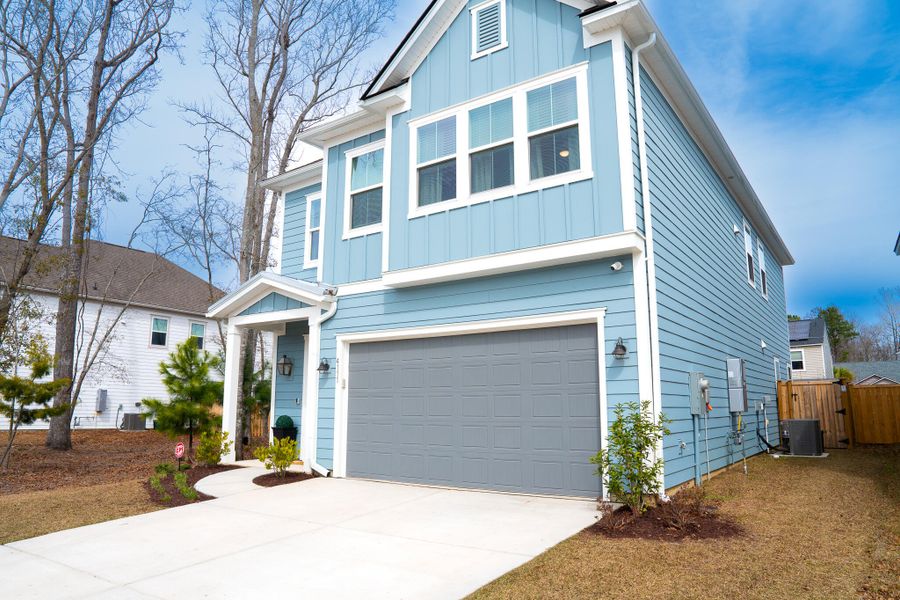 Front exterior of a new home in Park's Edge at Carolina Bay, Charleston, SC, highlighting curb appeal (Image 29). Front exterior of a new home in Park's Edge at Carolina Bay, Charleston, SC, highlighting curb appeal (Image 29).