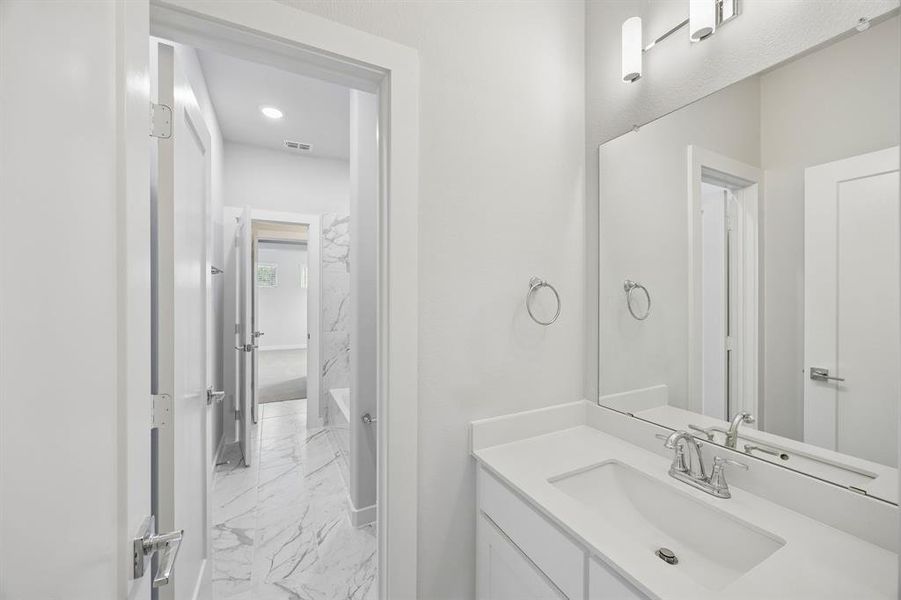 Dual Entry Bathroom in the Picasso II home plan by Trophy Signature Homes – REPRESENTATIVE PHOTO Dual Entry Bathroom in the Picasso II home plan by Trophy Signature Homes – REPRESENTATIVE PHOTO