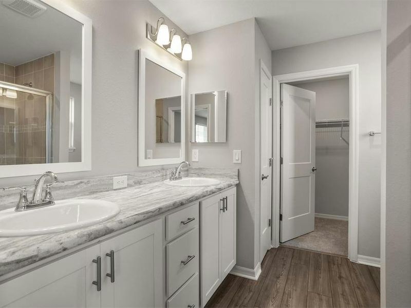 Your suite is complete with a walk-in wardrobe and a large en-suite bath with a tiled shower.