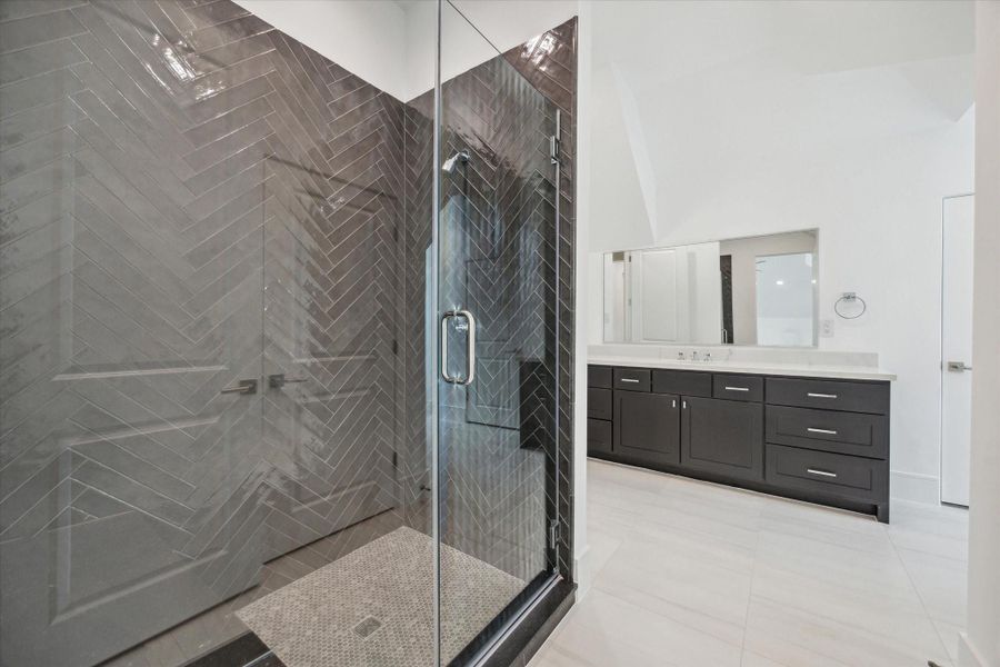 Hollywood bath on the third floor with large counter space, glass-encased shower, and walk-in closet. Hollywood bath on the third floor with large counter space, glass-encased shower, and walk-in closet.
