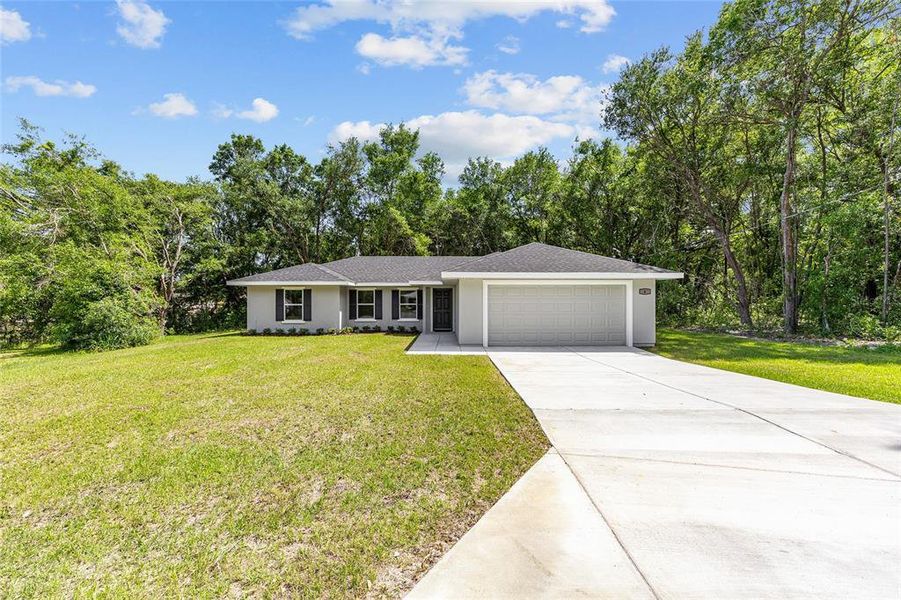 Front exterior of a new home in , Ocala, FL, highlighting curb appeal (Image 19).