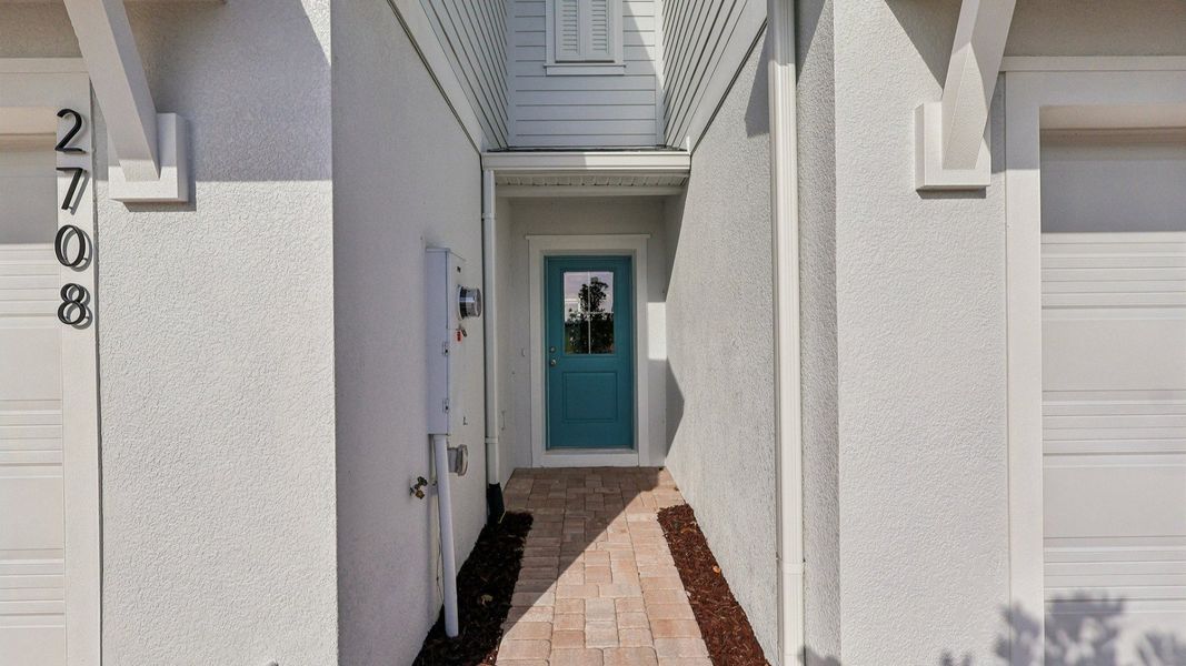 Exterior details and patio area of a home in Cyrene at Harmony, St. Cloud (Image 4).