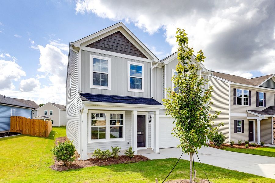 Front exterior of a new home in Bluefield, Lexington, SC, highlighting curb appeal (Image 2). Front exterior of a new home in Bluefield, Lexington, SC, highlighting curb appeal (Image 2).