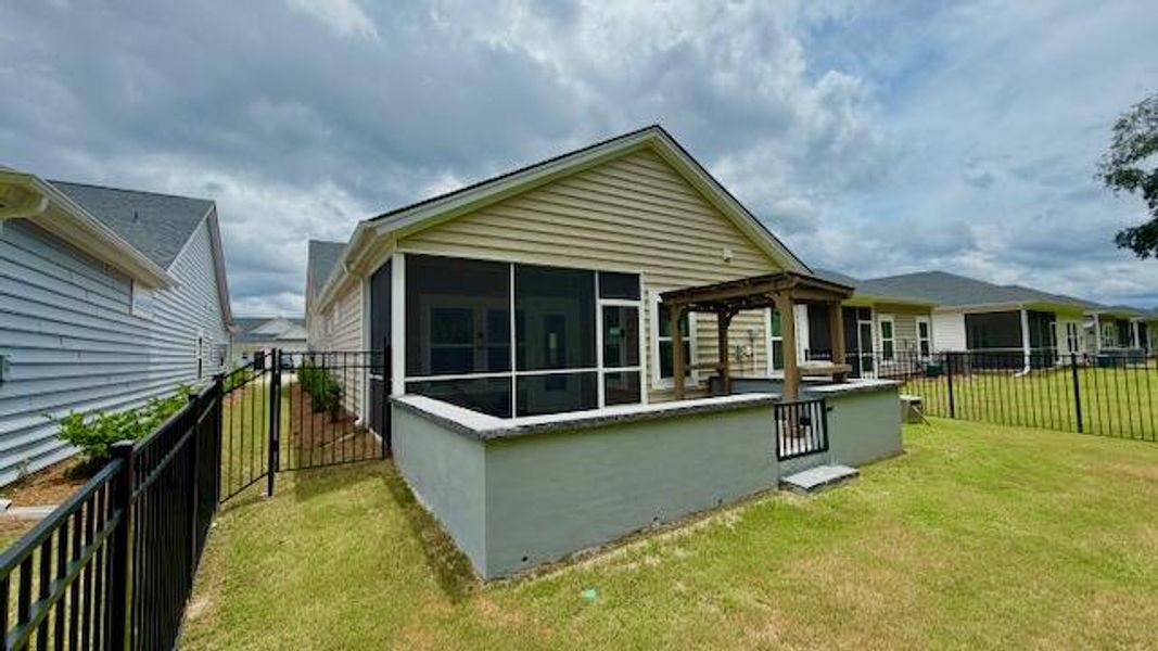 Exterior details and patio area of a home in Horizons at Summers Corner | 55+, Summerville (Image 18).