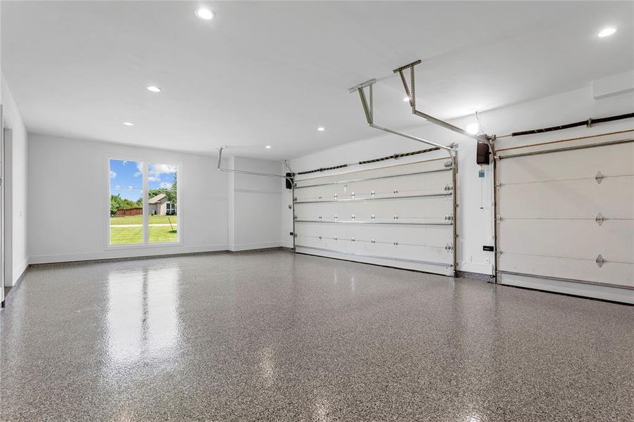 3 car garage with epoxy flooring.