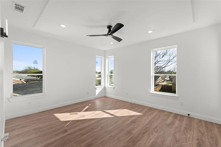 Spare room featuring wood finished floors, recessed lighting, and ceiling fan