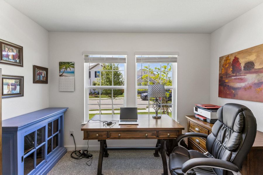 Front bedroom set up as office.