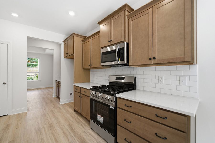 Furnished interior view inside a new home in Aden Woods, Fairview (Image 9).