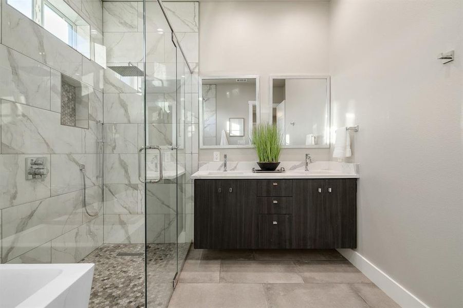 Bathroom with vanity and separate shower and tub