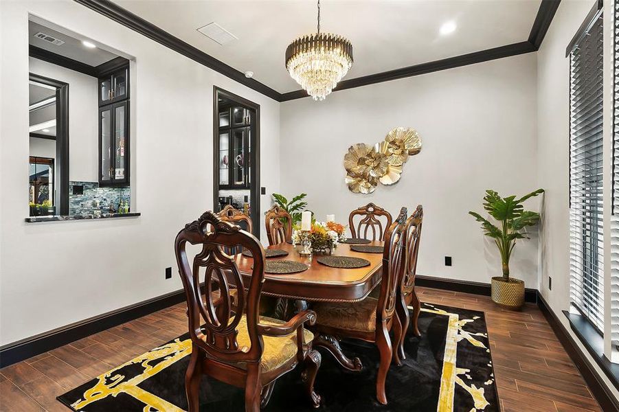 The dining room has a butler's pantry and a pass through to the bar.