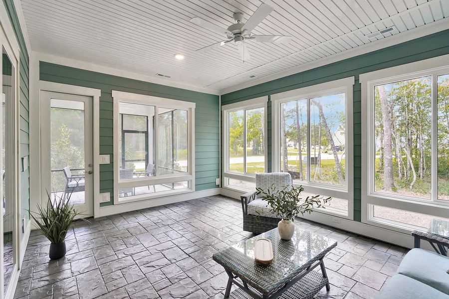 Exterior details and patio area of a home in The Bluffs On the Cape Fear, Leland (Image 20).