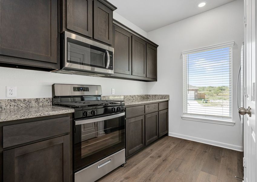 The kitchen has beautiful wood cabinetry. The kitchen has beautiful wood cabinetry.