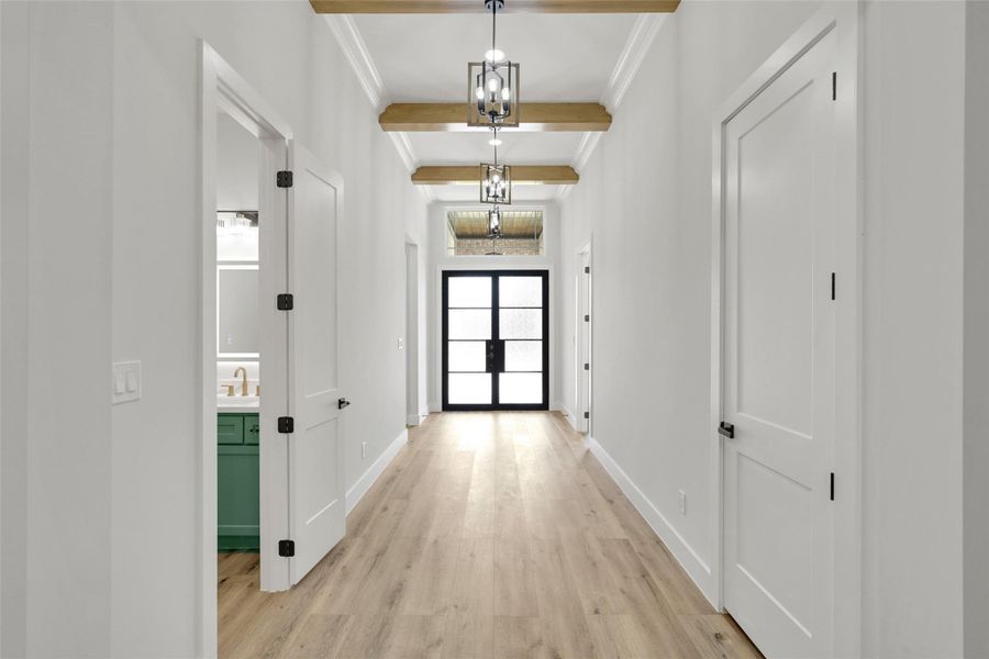 Grand entry with 12' ceilings and natural light streaming through the beautiful front door Grand entry with 12' ceilings and natural light streaming through the beautiful front door