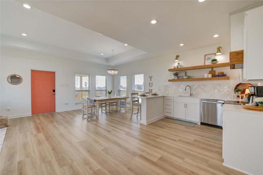 Bright open-concept living space filled with natural light and modern finishes