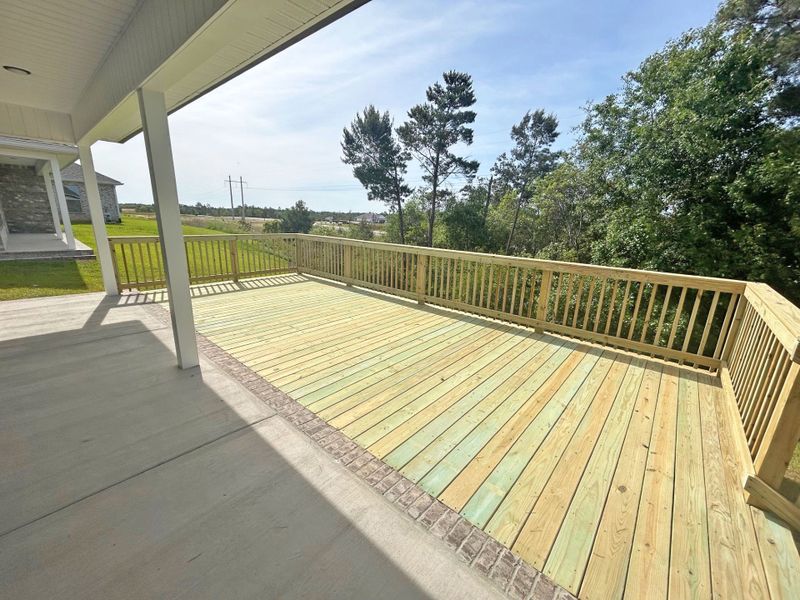 Front exterior of a new home in The Bluffs at Lafayette, Freeport, FL, highlighting curb appeal (Image 16).