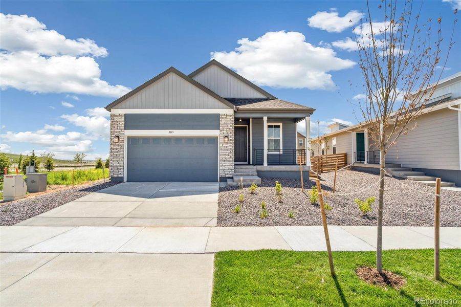 Front exterior of a new home in Legato, Commerce City, CO, highlighting curb appeal (Image 1).
