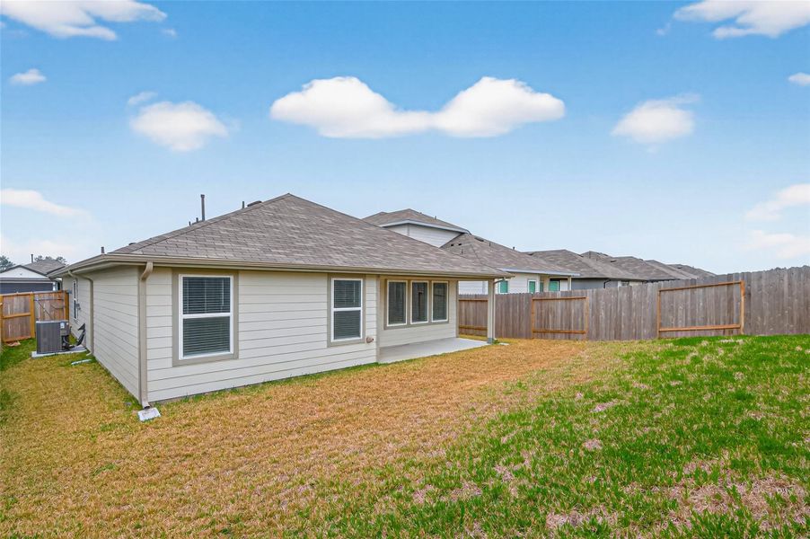 Exterior details and patio area of a home in Presswoods, Splendora (Image 3).
