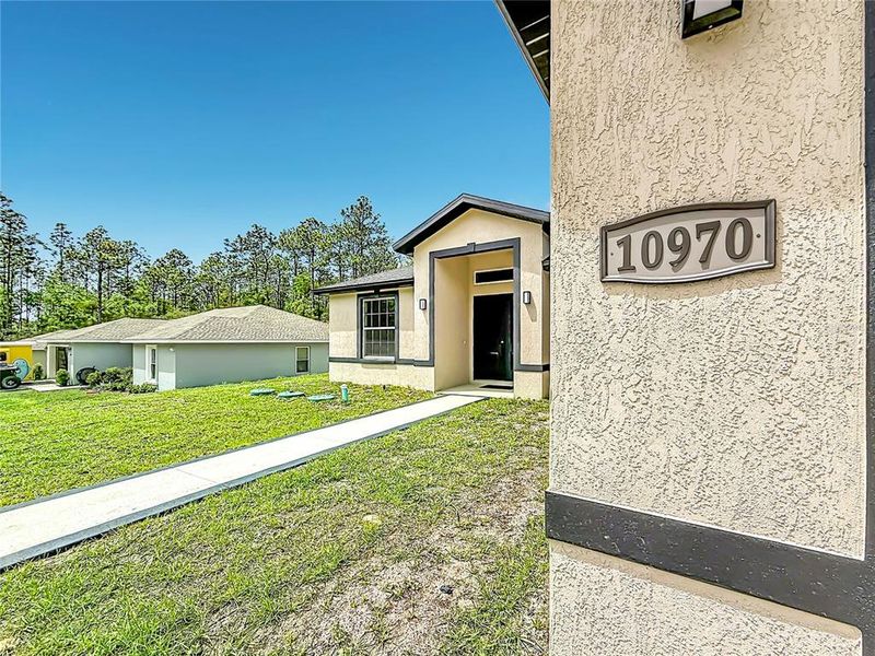 Exterior details and patio area of a home in , Citrus Springs (Image 24).