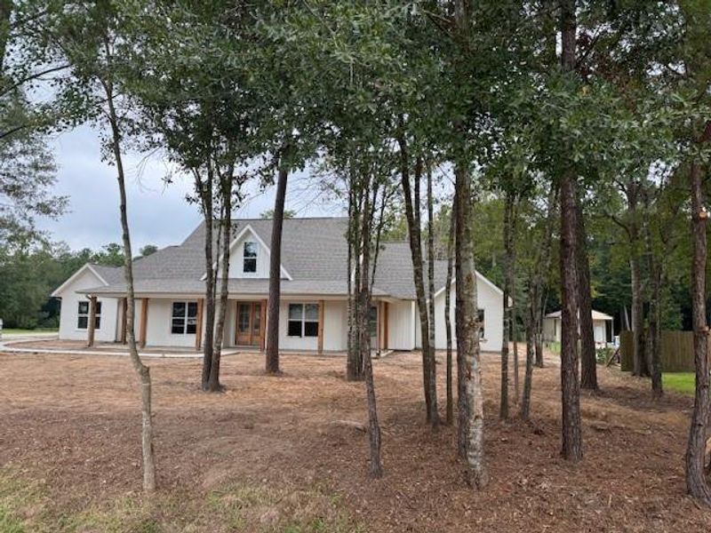Exterior details and patio area of a home in , Splendora (Image 6).