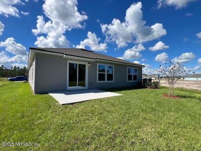 Exterior details and patio area of a home in Sawmill Branch Express, Palm Coast (Image 32). Exterior details and patio area of a home in Sawmill Branch Express, Palm Coast (Image 32).