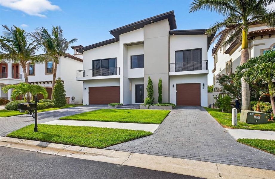 Front exterior of a new home in , Redington Shores, FL, highlighting curb appeal (Image 24).