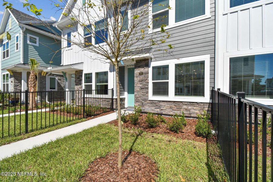 Exterior details and patio area of a home in Kettering at eTown - Garden Collection, Jacksonville (Image 17). Exterior details and patio area of a home in Kettering at eTown - Garden Collection, Jacksonville (Image 17).
