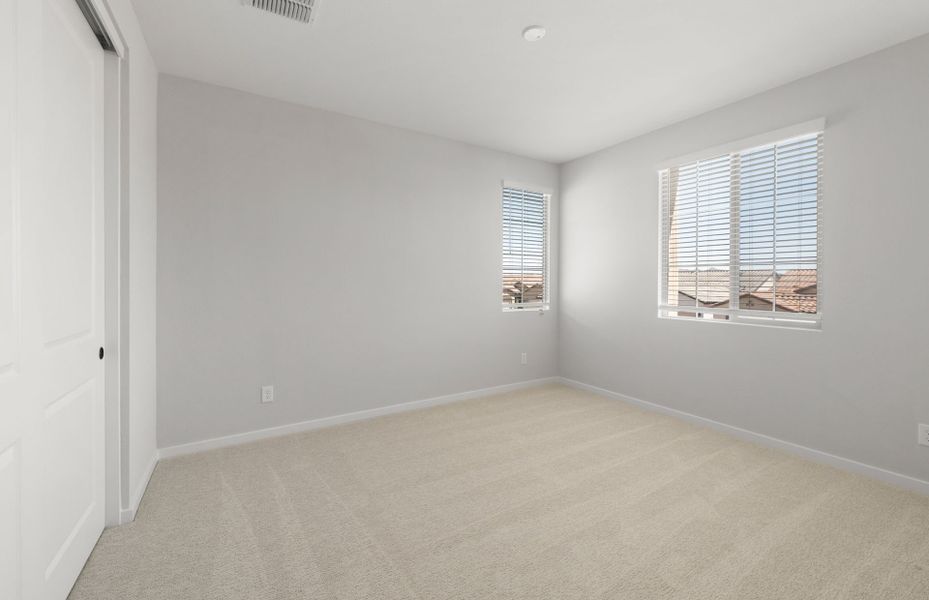 Spacious, unfurnished interior of a new home in Legado West, Queen Creek (Image 32).