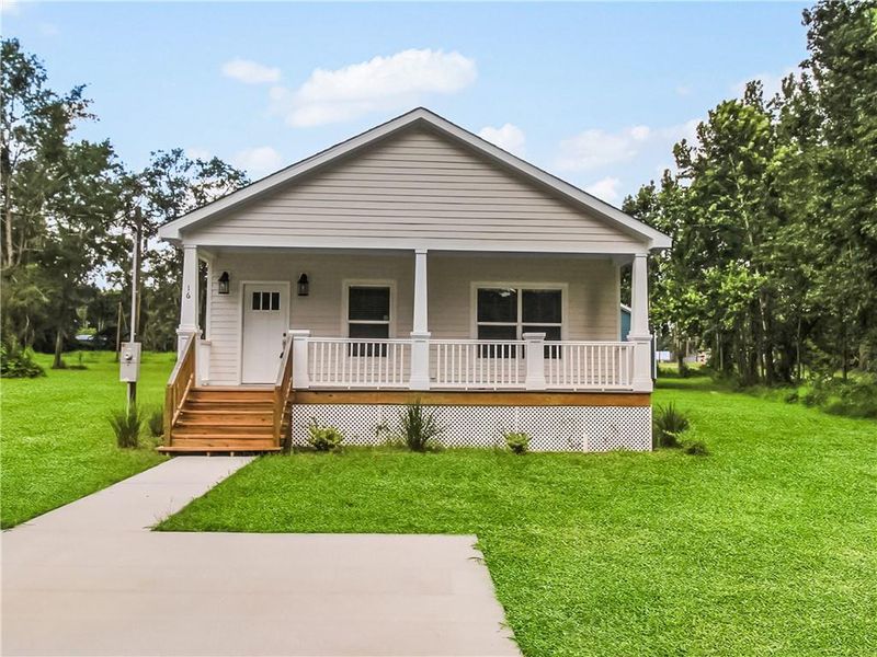 Front exterior of a new home in , Ludowici, GA, highlighting curb appeal (Image 1). Front exterior of a new home in , Ludowici, GA, highlighting curb appeal (Image 1).